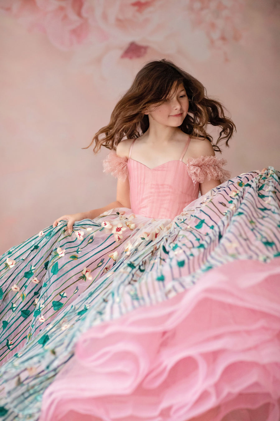 "Custom floral gown displayed with optional detachable petticoat for added volume"

