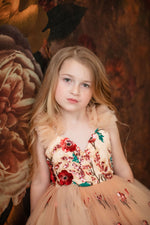 Full-length view of a luxury flower girl gown with petticoat volume

