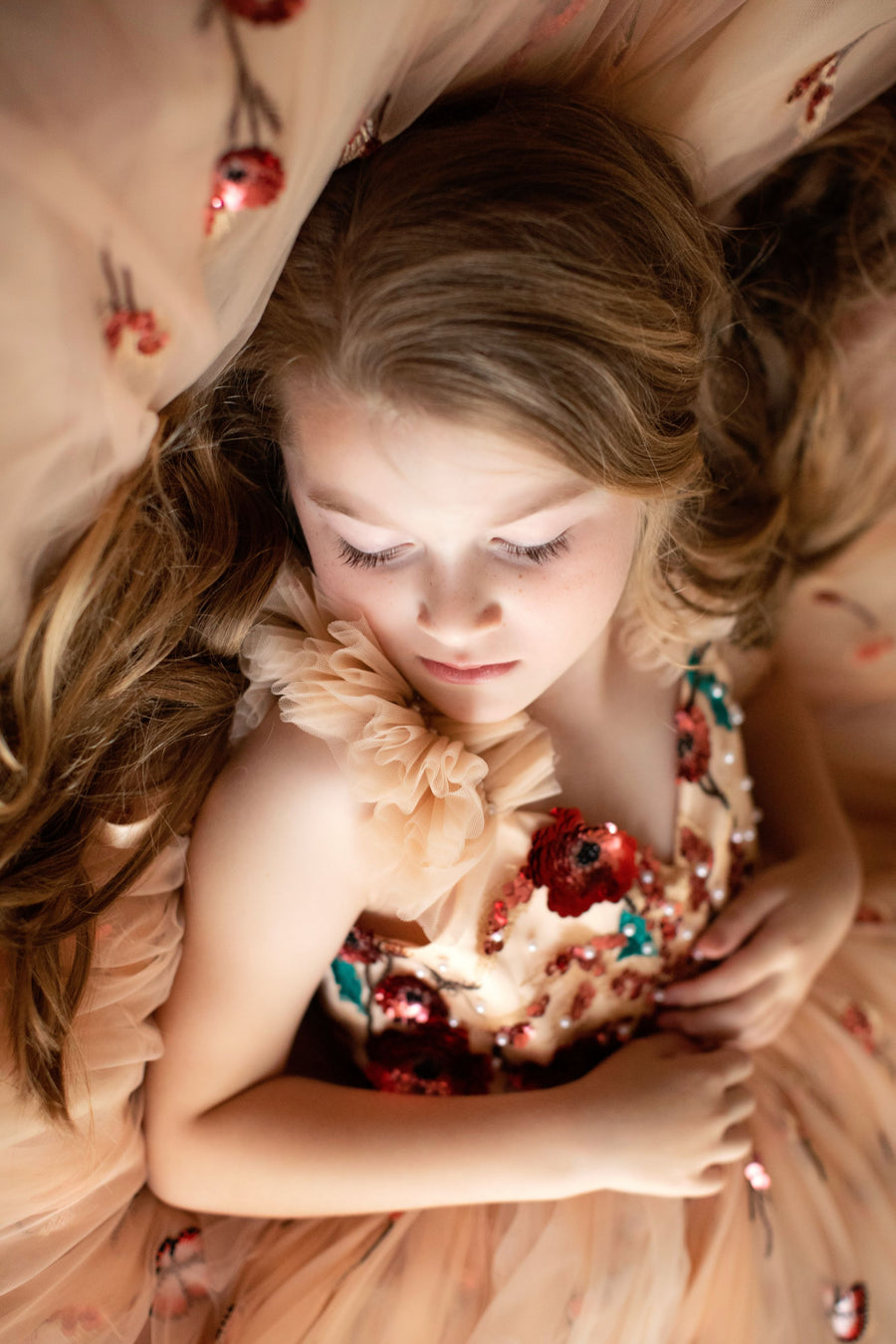 Children’s couture dress styled for spring or garden wedding

