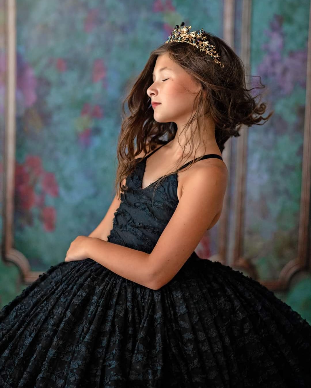 "Side view of custom couture gown for children with tulle skirt and detailed bodice"

