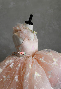"Side profile of the Anastasia gown, featuring adjustable shoulder ties and an elastic back for a customizable fit."

